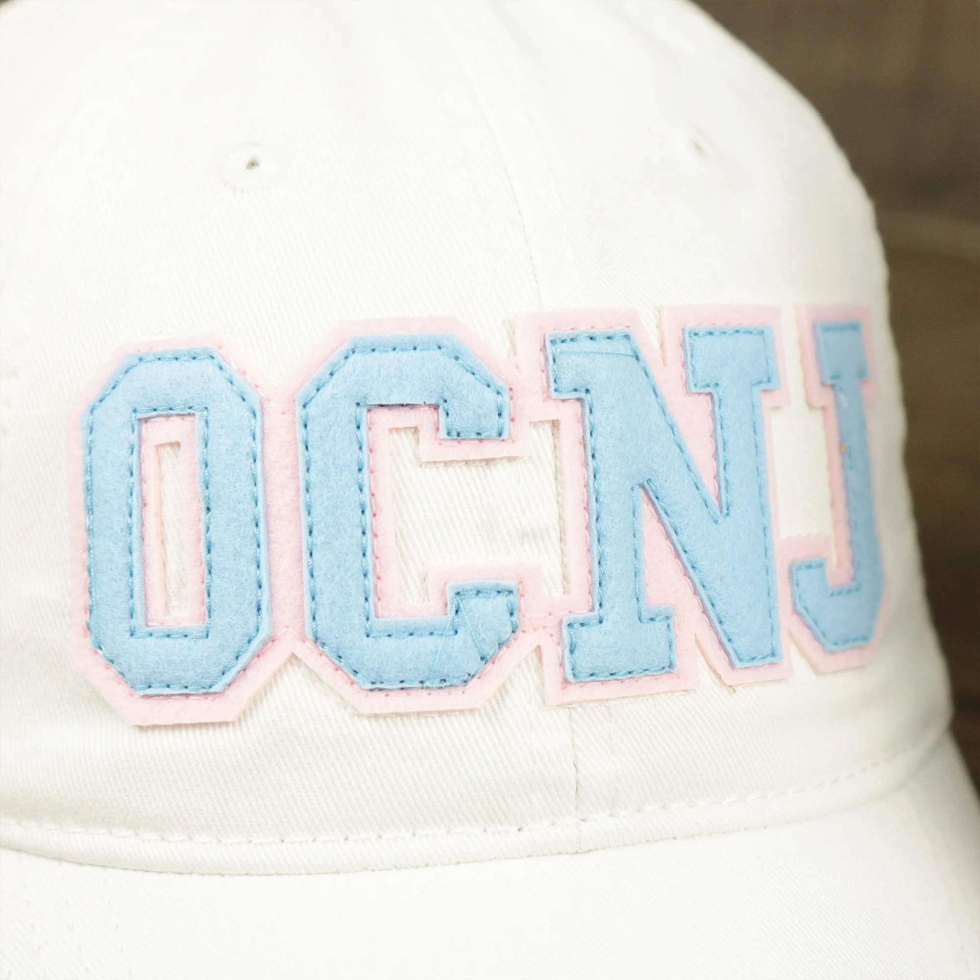 Youth Light Blue OCNJ Wordmark Pink Outline Dad Hat | Youth White Dad Hat