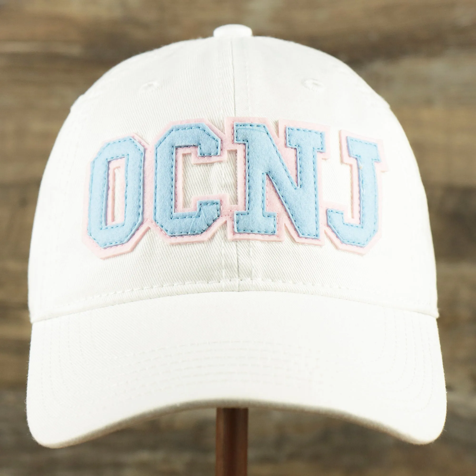 Youth Light Blue OCNJ Wordmark Pink Outline Dad Hat | Youth White Dad Hat