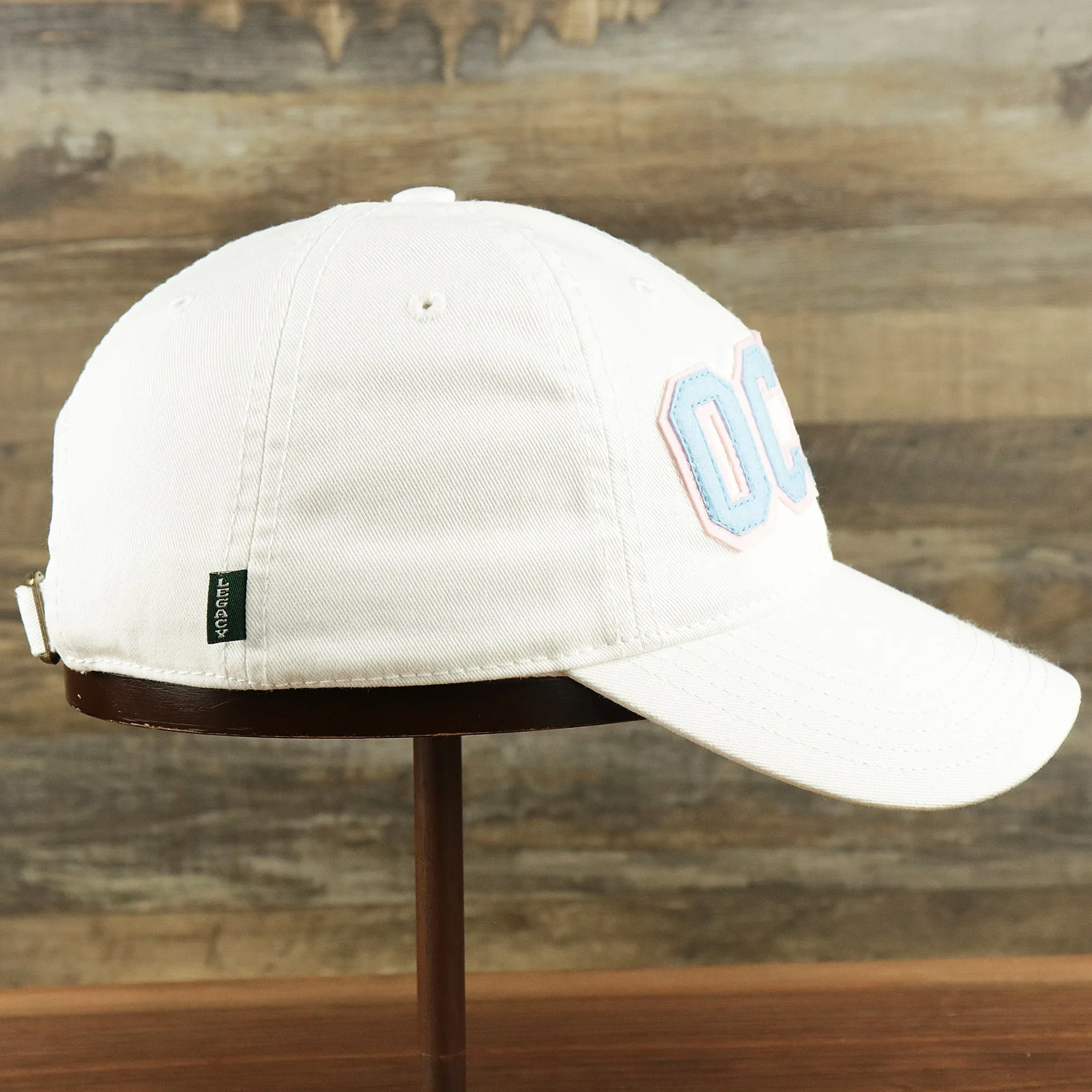 Youth Light Blue OCNJ Wordmark Pink Outline Dad Hat | Youth White Dad Hat